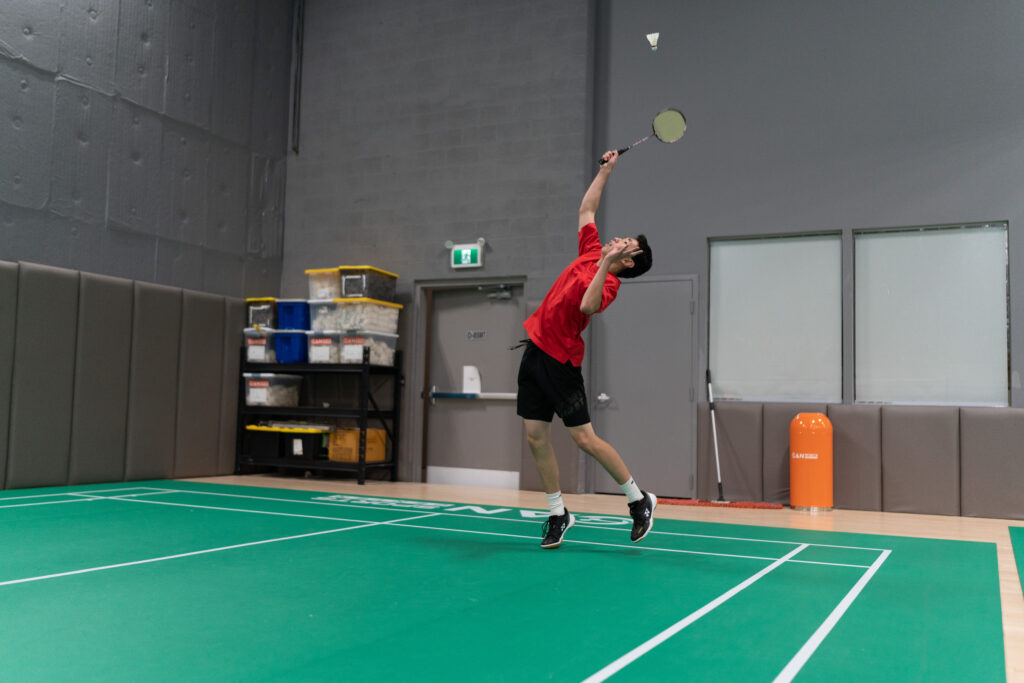 Youth badminton athletes competing at CAN Junior Open tournament, showcasing intense gameplay at CAN Sports Center in Markham
