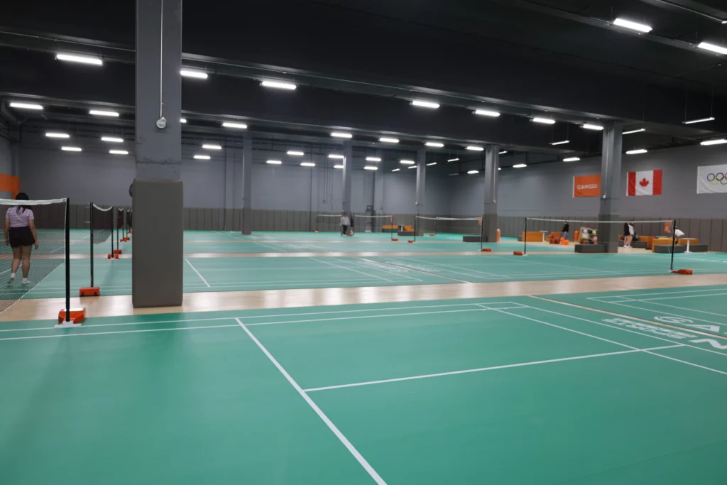 Professional indoor badminton courts at CAN Sports Center in Markham, equipped for CAN Junior Open 2025 tournament.