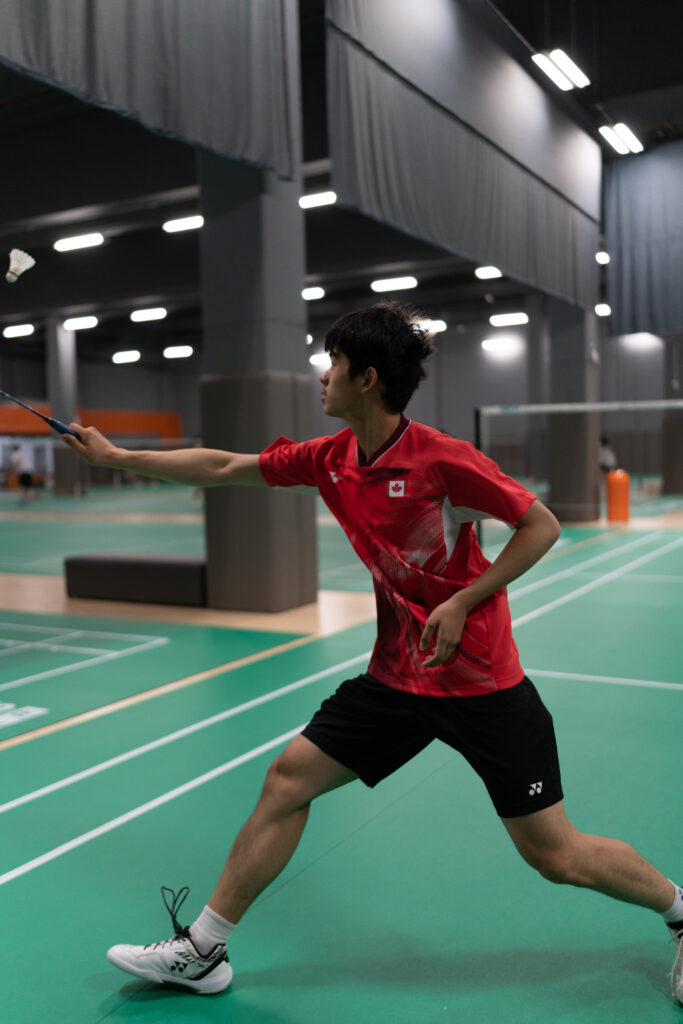 Youth badminton athletes competing at CAN Junior Open tournament, showcasing intense gameplay at CAN Sports Center in Markham