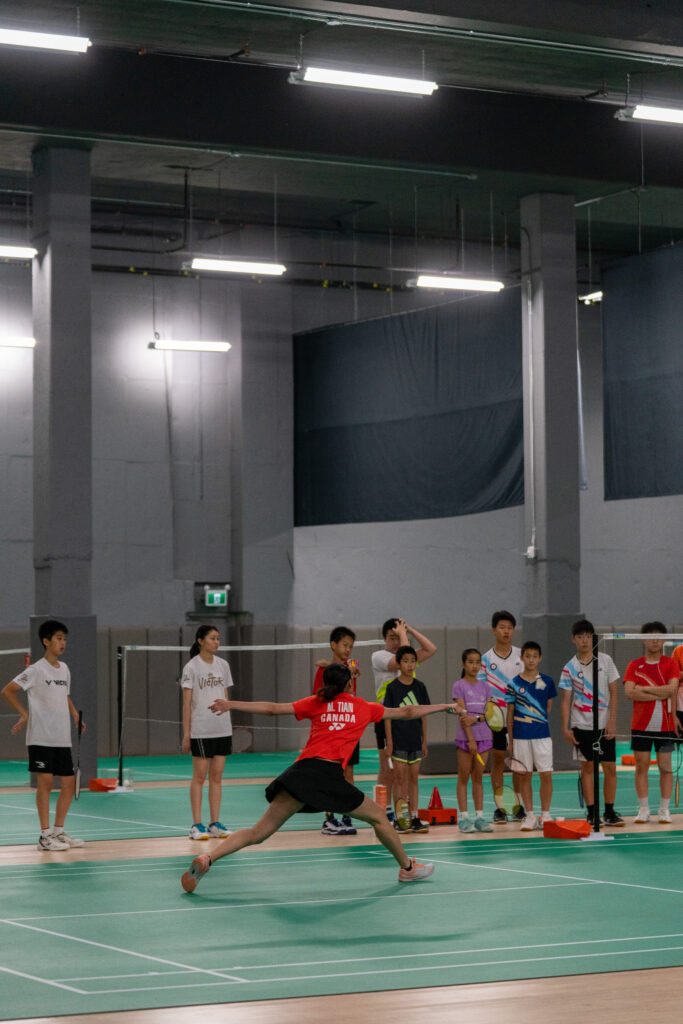 Youth badminton athletes competing at CAN Junior Open tournament, showcasing intense gameplay at CAN Sports Center in Markham